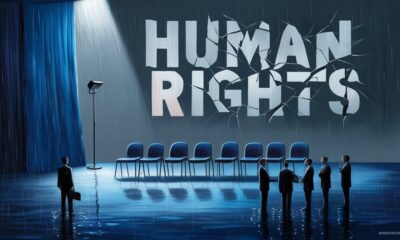 Ilustrasi simbolis panggung debat kosong dengan tulisan “HUMAN RIGHTS” retak dan aktivis bayangan di bawah hujan.