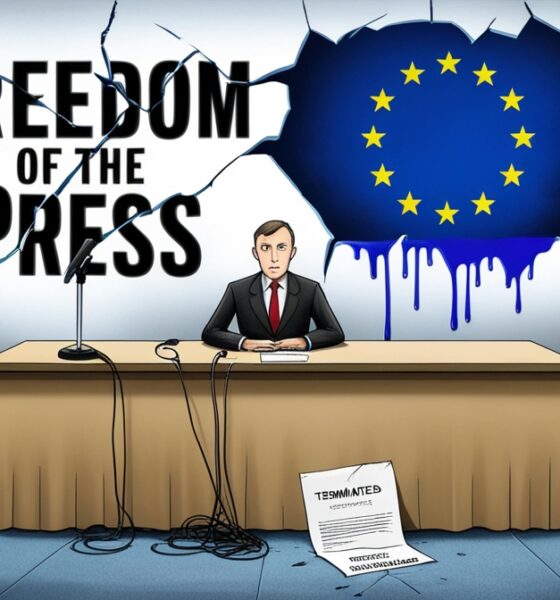 Jurnalis duduk sendirian di depan mikrofon terputus, dengan layar bertuliskan “Freedom of the Press” yang retak dan bendera Uni Eropa yang luntur di belakangnya.
